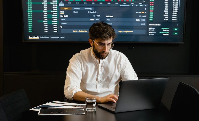 Focused Professional Man using Laptop